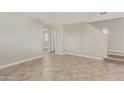 Bright living room with neutral walls, tile floors and an open and airy atmosphere at 17471 W Watson Ln, Surprise, AZ 85388