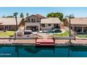 Stunning backyard oasis with pool, spa, waterfront access, and outdoor entertainment area at 20657 N 56Th Ave, Glendale, AZ 85308