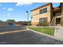 Well-maintained condo exterior with ample parking and manicured landscaping at 2134 E Broadway Rd # 2031, Tempe, AZ 85282