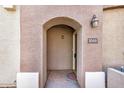 Inviting entryway featuring a welcoming door with an arched entryway and a stylish light fixture at 2401 E Rio Salado Pkwy # 1048, Tempe, AZ 85288
