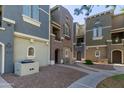 View of colorful townhome facades with landscaped grounds, offering a glimpse of community charm at 2401 E Rio Salado Pkwy # 1048, Tempe, AZ 85288