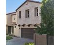 Beautiful two-story home with well-maintained landscaping, a two-car garage, and a charming entrance at 2412 W Gloria Ln, Phoenix, AZ 85085