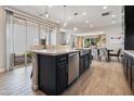 Spacious kitchen with a large island, stainless steel appliances, and an open layout with great lighting at 2412 W Gloria Ln, Phoenix, AZ 85085