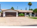 Single-Gathering home with mature trees and lush landscaping at 3050 E Cholla E St, Phoenix, AZ 85028
