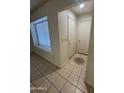 Inviting entryway features ceramic floors and a convenient coat closet at 3328 E Crescent Ave, Mesa, AZ 85204