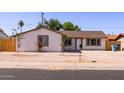 Inviting single-story home featuring desert landscaping, updated windows and a welcoming front entrance at 3812 W Seldon Ln, Phoenix, AZ 85051
