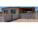 Gated driveway of single-Gathering home features security signs and decorative brickwork at 3952 E Baywood Ave, Mesa, AZ 85206