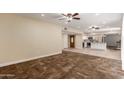 Bright and airy living room boasts a seamless flow with the adjacent open-concept kitchen at 6009 W Medlock Dr, Glendale, AZ 85301