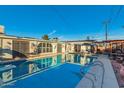 This backyard features a sparkling pool and a covered patio area for outdoor relaxation and entertaining at 6217 W Orange Dr, Glendale, AZ 85301