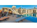 Outdoor space with a private pool, slide and relaxing bench, perfect for Gathering enjoyment and entertaining guests at 6217 W Orange Dr, Glendale, AZ 85301