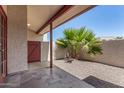 Private patio area featuring a desert landscape and accent wall at 633 W Southern Ave # 1181, Tempe, AZ 85282