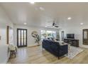 Inviting living room showcasing hardwood floors, a large window, and stylish furnishings at 7428 E Cambridge Ave, Scottsdale, AZ 85257