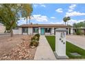 Inviting front exterior showcasing a walkway, manicured landscaping, and address marker at 932 W Julie Dr, Tempe, AZ 85283