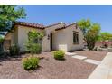 Inviting single-story home featuring well-maintained landscaping and a neutral color palette at 14759 W Alexandria Way, Surprise, AZ 85379