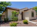 Well-kept single-story house with desert landscaping, complemented by a tile roof and stucco walls at 14759 W Alexandria Way, Surprise, AZ 85379
