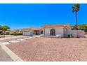 A beautiful single-Gathering home showcasing desert landscaping, a red tile roof, and white exterior at 17025 E De Anza Dr, Fountain Hills, AZ 85268