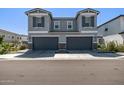 Well-maintained gray home featuring a two-car garage and manicured landscaping at 17118 N 50Th Way, Scottsdale, AZ 85254