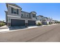 View of well-built homes with neat landscaping on a sunny street at 17118 N 50Th Way, Scottsdale, AZ 85254