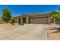 Charming single-story home featuring a neutral color scheme and a well-maintained xeriscaped front yard at 17796 W Andora St, Surprise, AZ 85388