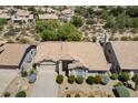 An aerial view showcasing the home's roof, landscaping, and neighborhood at 19102 N 91St St, Scottsdale, AZ 85255
