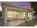 Relaxing covered patio with ceiling fan and access to the backyard at 19102 N 91St St, Scottsdale, AZ 85255