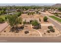 Well-maintained home on a spacious lot with desert landscaping, surrounded by lush greenery and mountain views at 22201 E Vallejo St, Queen Creek, AZ 85142