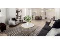 Bright living room featuring elegant decor and wood-look flooring at 27713 N 57Th Dr, Phoenix, AZ 85083