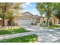 Beautiful single-Gathering home with a lovely front lawn, charming front porch, and two-car garage at 3534 E Linda Ln, Gilbert, AZ 85234