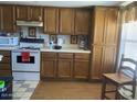 Traditional kitchen featuring wood cabinets, white appliances, and tile countertops at 774 E Morningside Dr, Phoenix, AZ 85022
