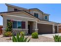 Well-maintained home featuring desert landscaping, charming accents, and a welcoming entrance at 997 E White Wing Dr, Casa Grande, AZ 85122