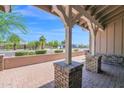View of the home's covered front porch with brick columns and brick-paved patio at 1336 E Belmont Ave, Phoenix, AZ 85020