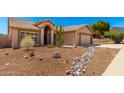 Inviting single-story home showcasing desert landscaping and charming curb appeal at 15226 S 14Th Dr, Phoenix, AZ 85045