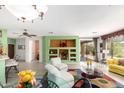 Cozy living area with built-in shelving, modern furnishings, and an open layout at 41227 N Rolling Green Way, Anthem, AZ 85086