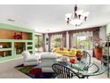 Spacious living room with colorful decor, comfortable seating and plenty of natural light at 41227 N Rolling Green Way, Anthem, AZ 85086