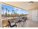 Enjoy city views from this cozy balcony with a table and chairs at 4200 N Miller Rd # 408, Scottsdale, AZ 85251