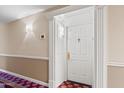 Condo entrance featuring a white door with stylish hallway decor at 4200 N Miller Rd # 408, Scottsdale, AZ 85251