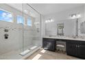 Bright bathroom featuring a glass-enclosed shower, double vanity, and modern fixtures at 4346 S Synapse Dr, Mesa, AZ 85212