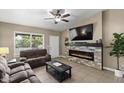 Cozy living room with a stone fireplace and comfortable seating at 6605 W Altadena Ave, Glendale, AZ 85304