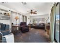 Comfortable living room with ceiling fan, natural light, and neutral decor at 7807 E Main St # E2, Mesa, AZ 85207
