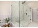 Stylish bathroom with a glass enclosed shower featuring modern fixtures and a built-in bench at 9112 E Palm Tree Dr, Scottsdale, AZ 85255