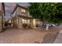 Charming two-story home showcasing a covered porch and well-kept landscaping at 9350 W Williams St, Tolleson, AZ 85353