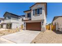 Attractive two-story home with a brown garage door and desert landscaping at 9412 E Sequence Ave, Mesa, AZ 85212