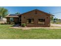 Single story home with a low-maintenance landscape and a large picture windows at 19302 W Melvin St, Buckeye, AZ 85326