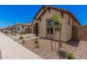 Beautiful home with desert landscaping, stone accents, and a charming front yard at 19354 S 212Th Pl, Queen Creek, AZ 85142