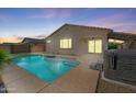 Beautiful pool and patio area featuring a hot tub, covered patio, and easy access to the home at 21075 E Estrella Rd, Queen Creek, AZ 85142