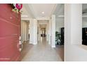 Bright entryway with tile flooring, neutral walls, and an open view into the rest of the home at 23060 E Sonoqui Blvd, Queen Creek, AZ 85142