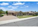 Charming home with brick driveway, manicured lawn, and desert landscaping at 2370 W Maplewood St, Chandler, AZ 85286