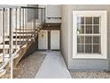 Welcoming condo exterior showcasing the stairs to units, secure doors and a stone path at 255 S Kyrene Rd # 139, Chandler, AZ 85226