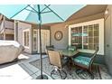 Comfortable patio with cozy seating, umbrella, and views of the beautiful landscape at 255 S Kyrene Rd # 139, Chandler, AZ 85226