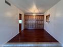 Traditional dining room featuring dark wood floors and matching built-in wood cabinets at 3145 W Acoma Dr, Phoenix, AZ 85053